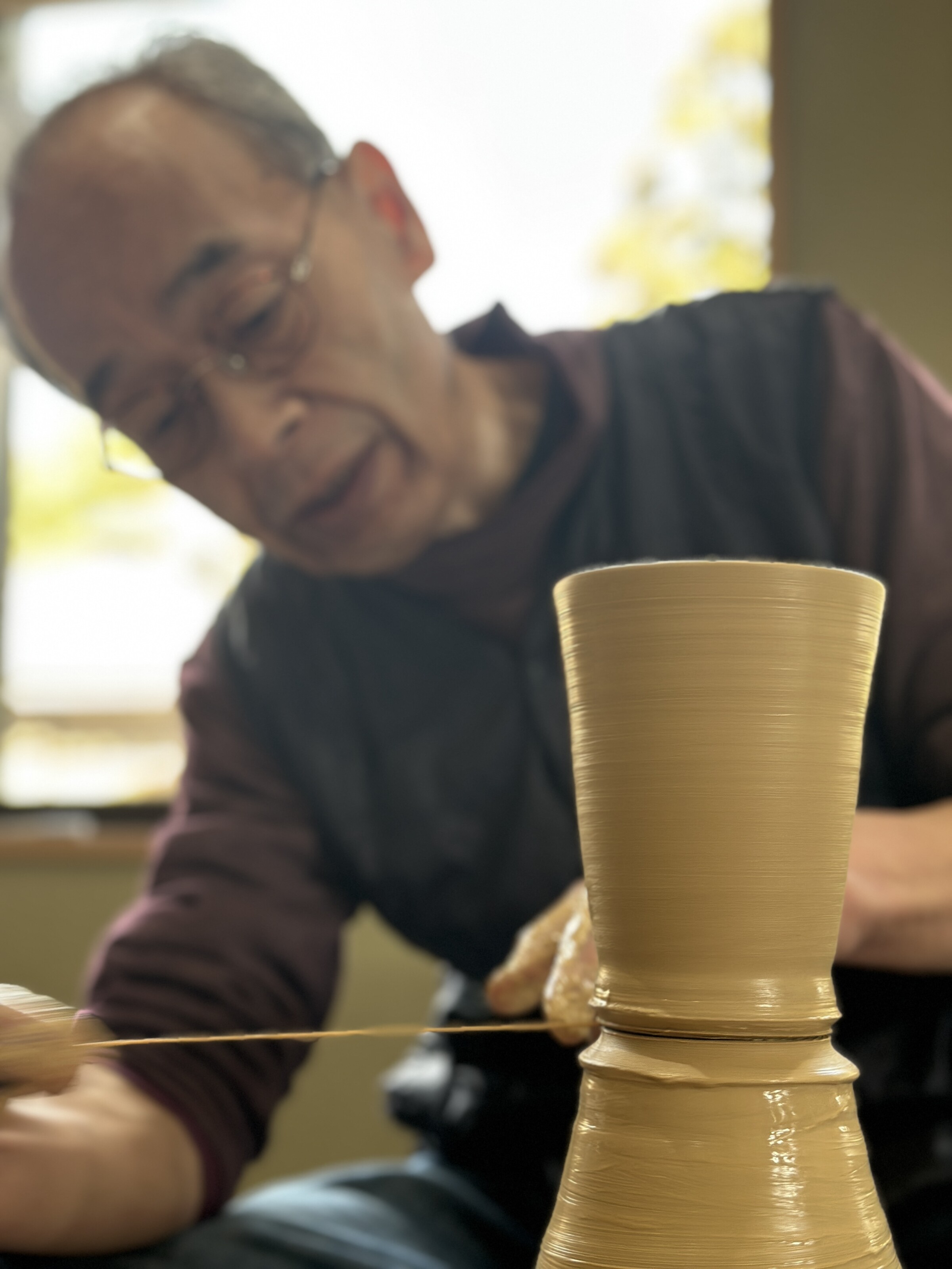 A man working at a pottery wheel